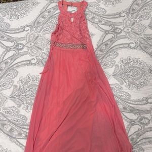 A bright pink dress with a rhinestone belt from Macys